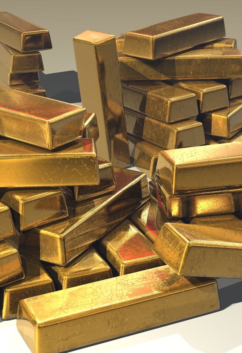 A pile of lustrous gold bars symbolizing wealth and prosperity.